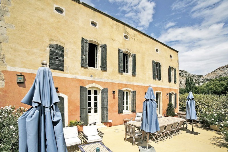 Between Luberon and Alpilles, for sale, provencal castle with outbuildings, on several hectares of hilly land with swimming pool