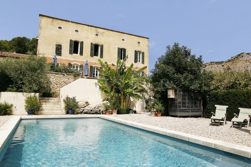 Between Luberon and Alpilles, for sale, provencal castle with outbuildings, on several hectares of hilly land with swimming pool