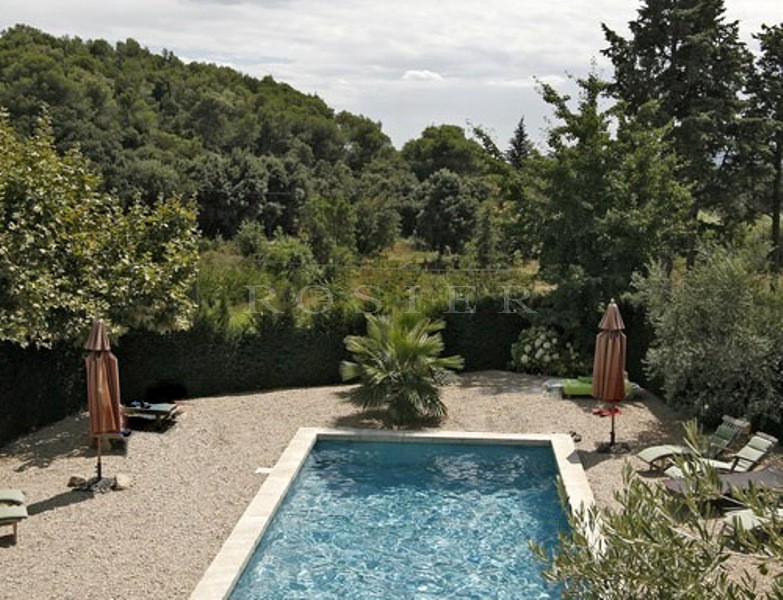 Between Luberon and Alpilles, for sale, provencal castle with outbuildings, on several hectares of hilly land with swimming pool