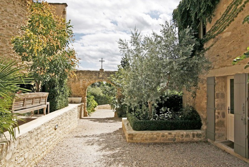 Between Luberon and Alpilles, for sale, provencal castle with outbuildings, on several hectares of hilly land with swimming pool