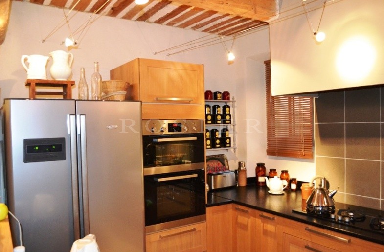 In the heart of an authentic Luberon village: village house with interior courtyard and outbuildings