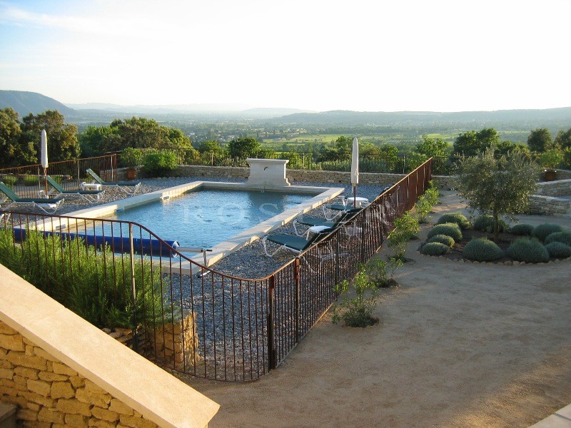 Close to Gordes in Luberon, for sale, a contemporary stone-built house offering sweeping views of the valley and the Luberon and Alpilles mountains