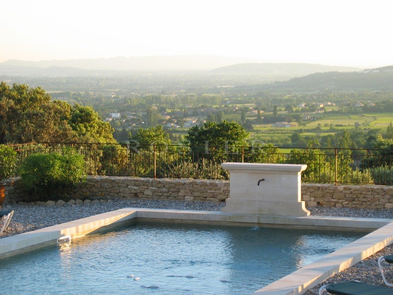 Close to Gordes in Luberon, for sale, a contemporary stone-built house offering sweeping views of the valley and the Luberon and Alpilles mountains