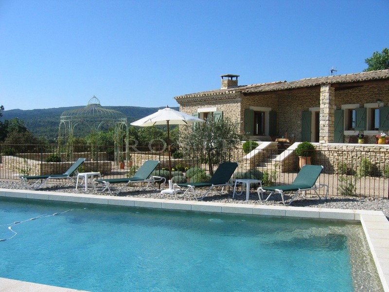 Close to Gordes in Luberon, for sale, a contemporary stone-built house offering sweeping views of the valley and the Luberon and Alpilles mountains