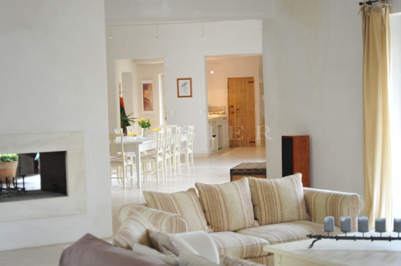 In the Luberon, a few minutes from Gordes and Roussillon, for sale, a contemporary stone house with a swimming pool and views of the Luberon