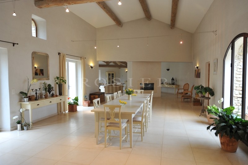 In the Luberon, a few minutes from Gordes and Roussillon, for sale, a contemporary stone house with a swimming pool and views of the Luberon