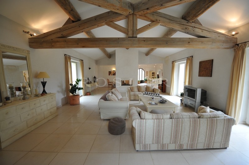 In the Luberon, a few minutes from Gordes and Roussillon, for sale, a contemporary stone house with a swimming pool and views of the Luberon