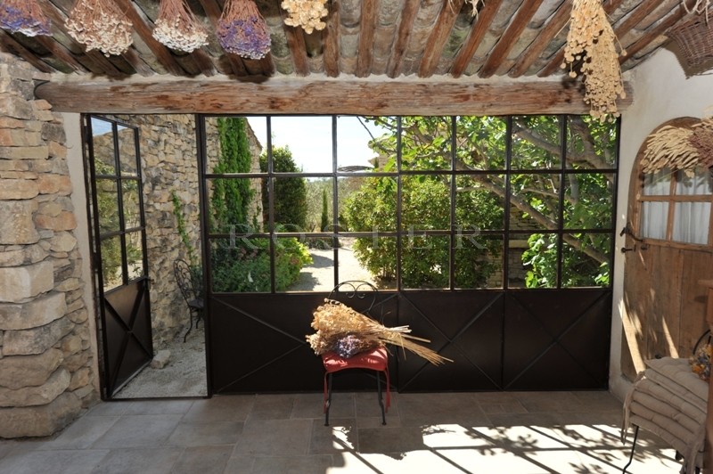 Gordes, for sale, a beautiful family farmhouse with outbuildings and a swimming pool offering breathtaking views over the Luberon, the Alpilles and surrounding countryside