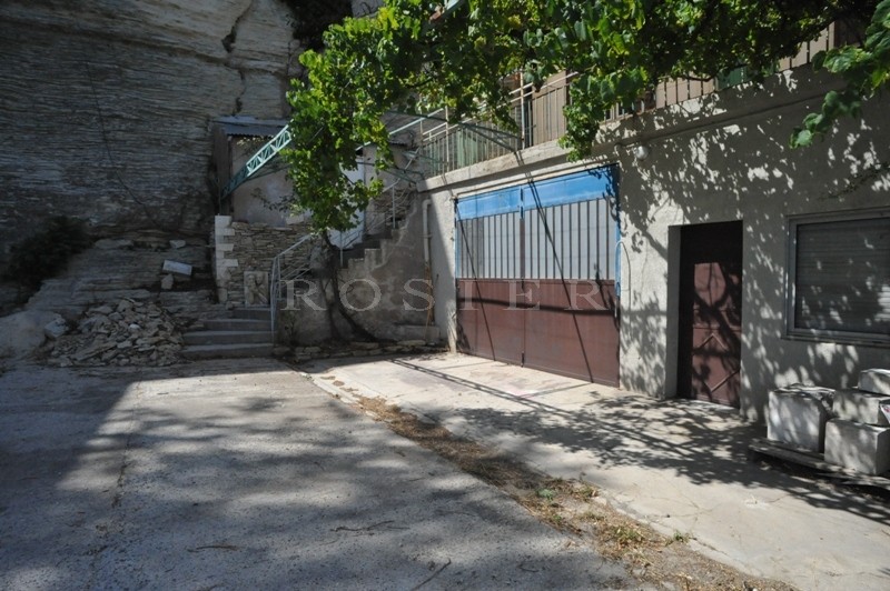 In the heart of Gordes village, looking out on the valley and near to all amenities, for sale village house with required renovation work.