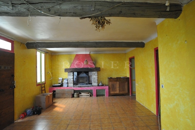 In the heart of Gordes village, looking out on the valley and near to all amenities, for sale village house with required renovation work.