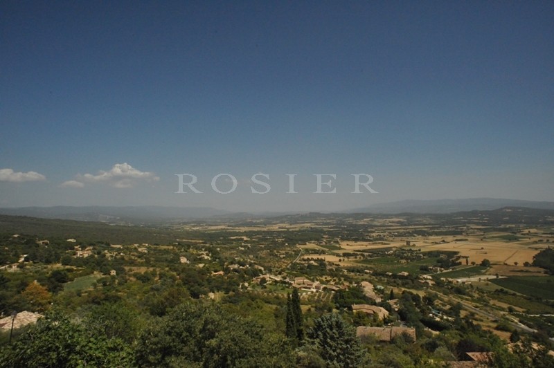 In the heart of Gordes village, looking out on the valley and near to all amenities, for sale village house with required renovation work.