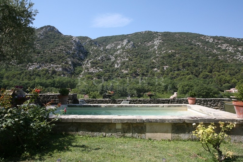 Luberon, for sale, superb stone village house with garden, swimming pool, views on the provençal countryside