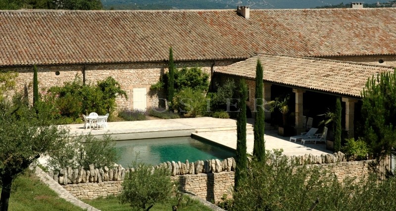 In Luberon, for sale, high end property, approximately 3 000 m²,  with 33 hectares with vineyards, wood, olive trees. 