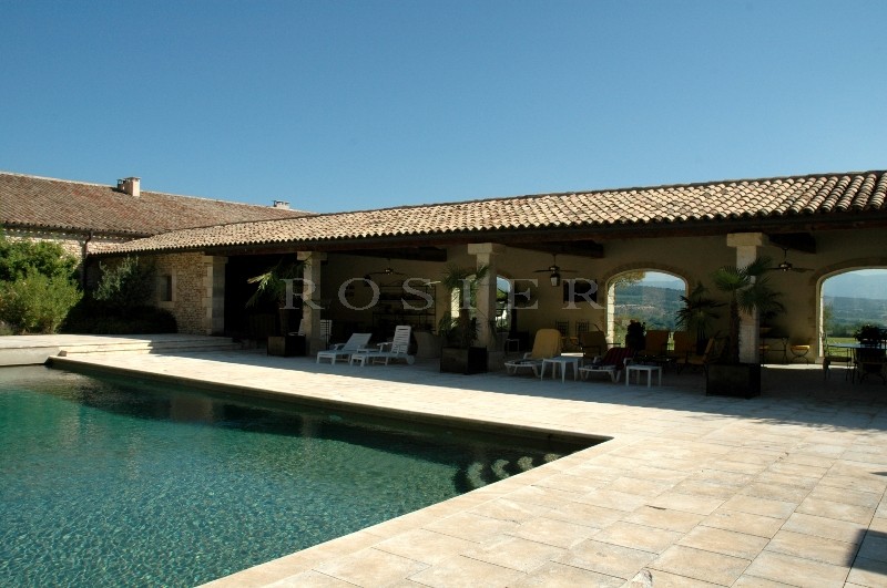 In Luberon, for sale, high end property, approximately 3 000 m²,  with 33 hectares with vineyards, wood, olive trees. 