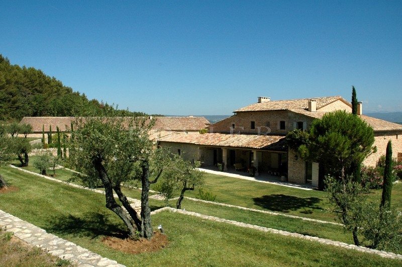 In Luberon, for sale, high end property, approximately 3 000 m²,  with 33 hectares with vineyards, wood, olive trees. 
