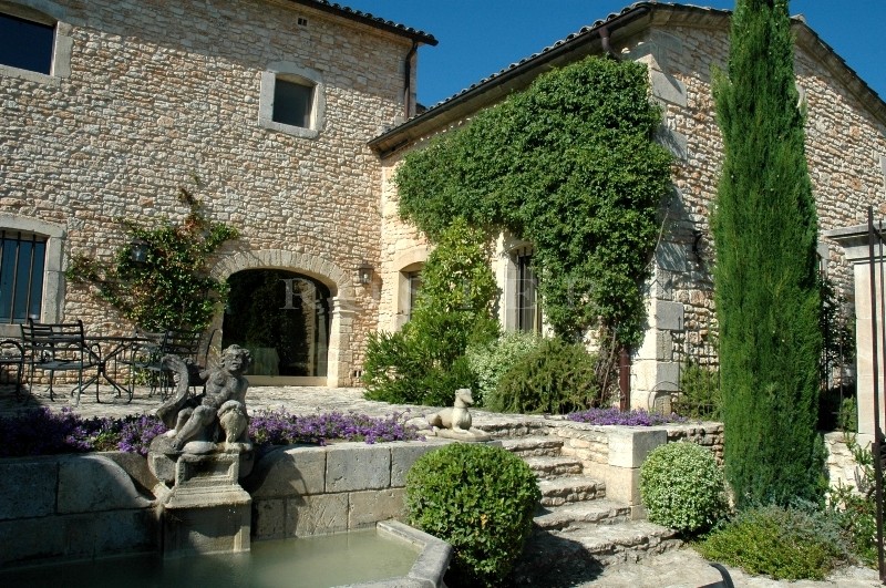 In Luberon, for sale, high end property, approximately 3 000 m²,  with 33 hectares with vineyards, wood, olive trees. 