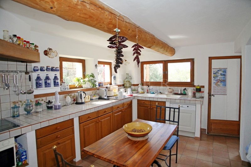For sale, in a very sought after hamlet near Gordes in Provence, stone-clad house with outbuildings on 5,000 m² of landscaped grounds