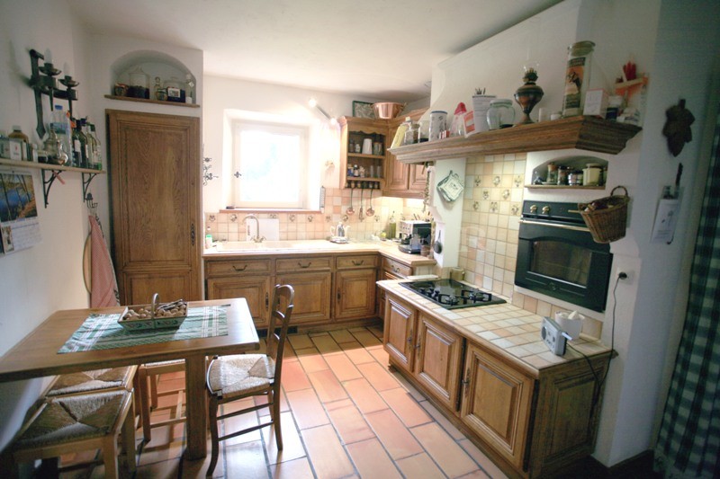 For sale in Luberon, just a few minutes away from the most prestigious hilltop village in Luberon, a stone-clad property comprising two houses with approximately 200 m² of living space. 
