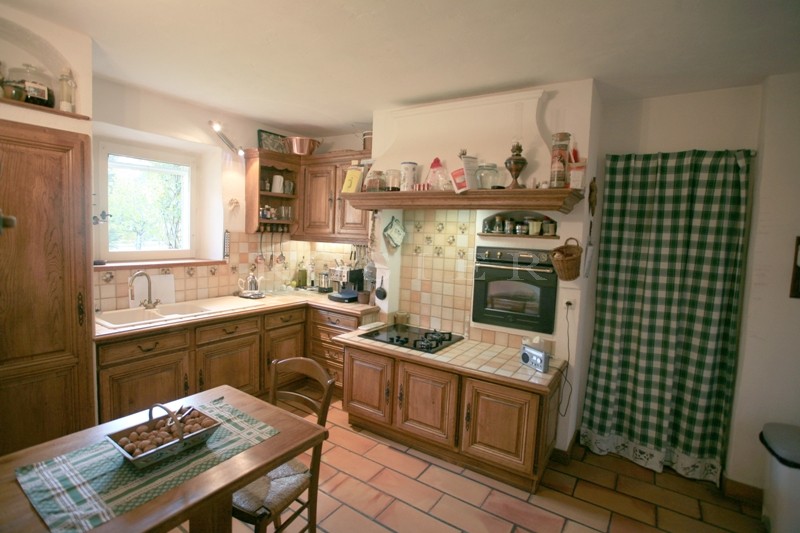 For sale in Luberon, just a few minutes away from the most prestigious hilltop village in Luberon, a stone-clad property comprising two houses with approximately 200 m² of living space. 
