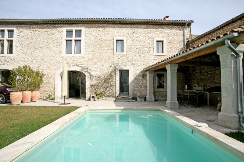 In the Luberon, for sale, a five bedroomed house at the heart of a village with garden and swimming pool