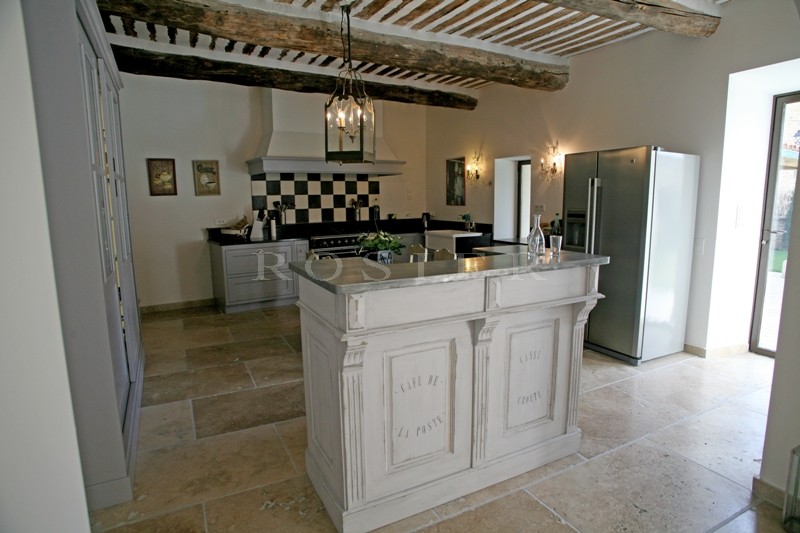 In the Luberon, for sale, a five bedroomed house at the heart of a village with garden and swimming pool