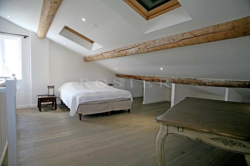 In the Luberon, for sale, a five bedroomed house at the heart of a village with garden and swimming pool
