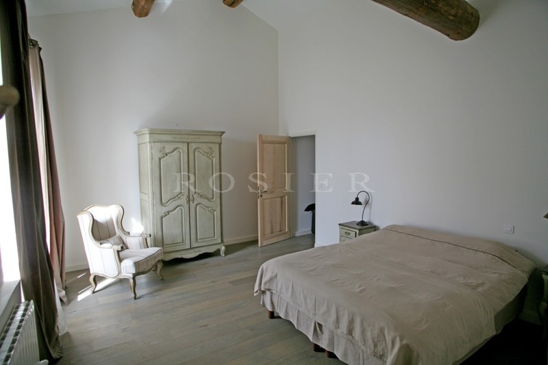 In the Luberon, for sale, a five bedroomed house at the heart of a village with garden and swimming pool