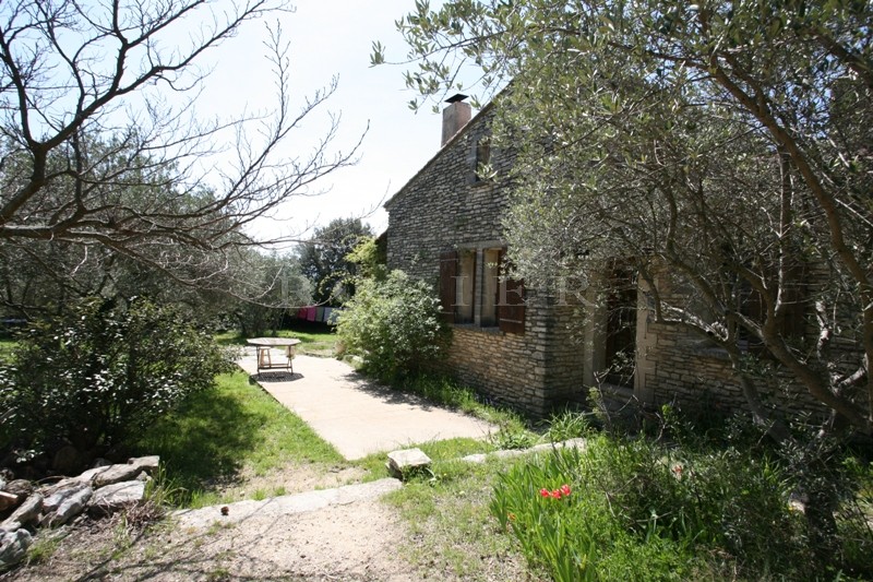 Gorde, close to the centre of the famous Luberon hilltop village, for sale, one storey stone house with a large garden
