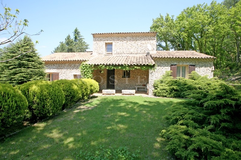 At the foot of the village of Gordes, stone house with a large garden