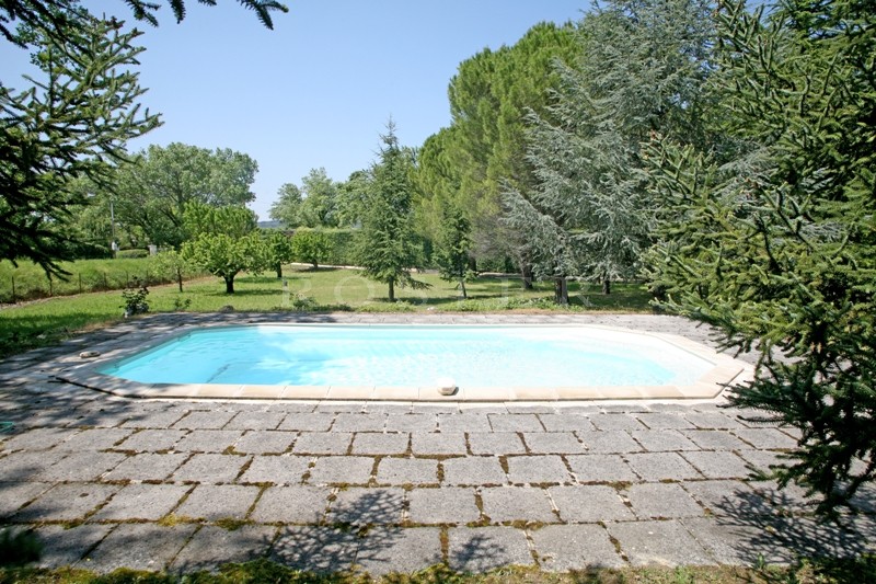 At the foot of the village of Gordes, stone house with a large garden