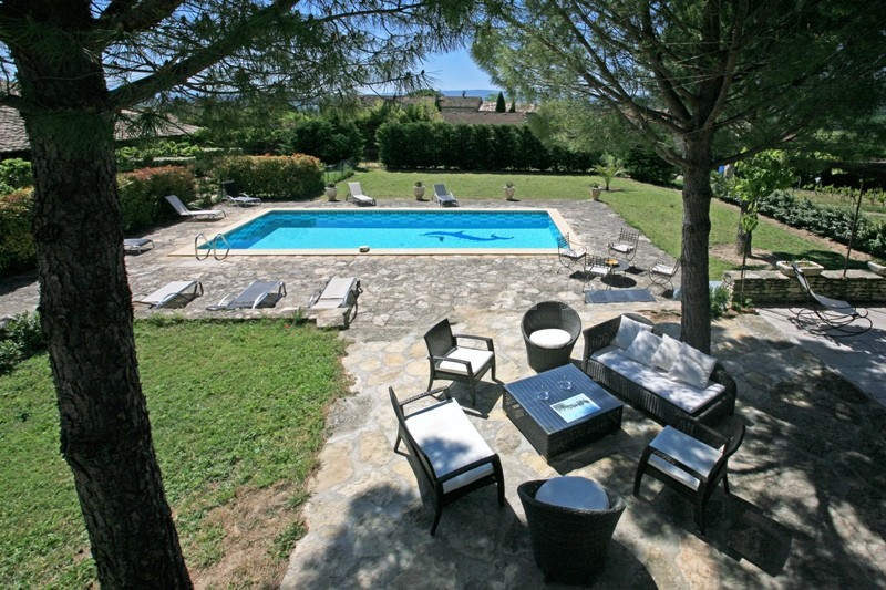 For sale in Luberon, large stone house with guest houses in Luberon with swimming pool, views and terraces. 