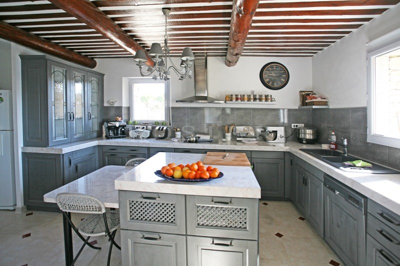 For sale in Luberon, large stone house with guest houses in Luberon with swimming pool, views and terraces. 