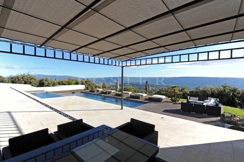 In dominant position, in front of Luberon, overlooking the valley and just a few minutes walk from one of the most beautiful villages of France, for sale, unique luxury contemporary property on more than 6 hectares.