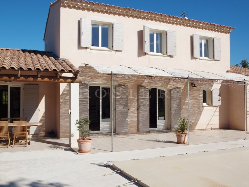 Near the hilltop village of Lacoste, for sale, contemporary of 6 main rooms, with a beautiful terraces, landscaped garden and heated swimming pool.