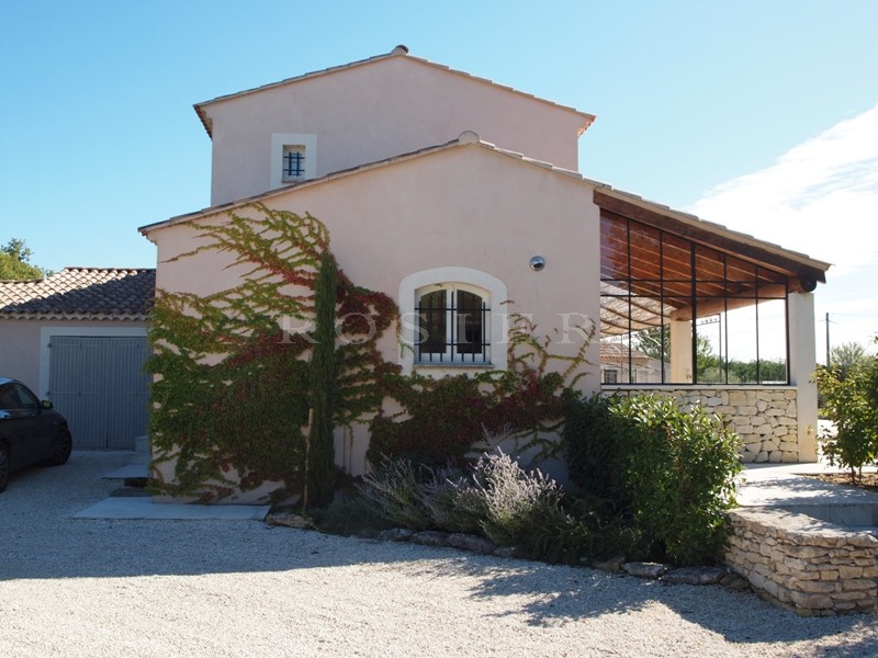 Near the hilltop village of Lacoste, for sale, contemporary of 6 main rooms, with a beautiful terraces, landscaped garden and heated swimming pool.