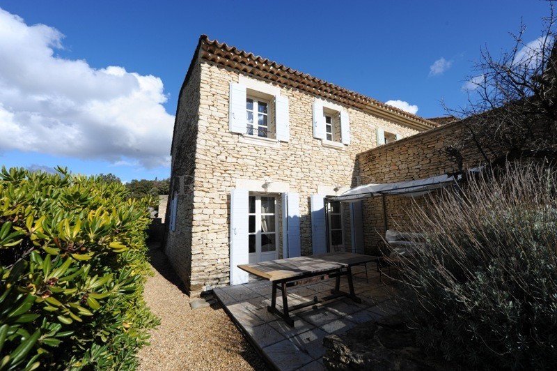 For sale in Gordes, in the village center, very charming stone built 2 storey house with swimming pool and garage