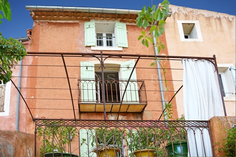 In a famous village of Luberon, for sale, charming house with garden, terrace and shop in a great location