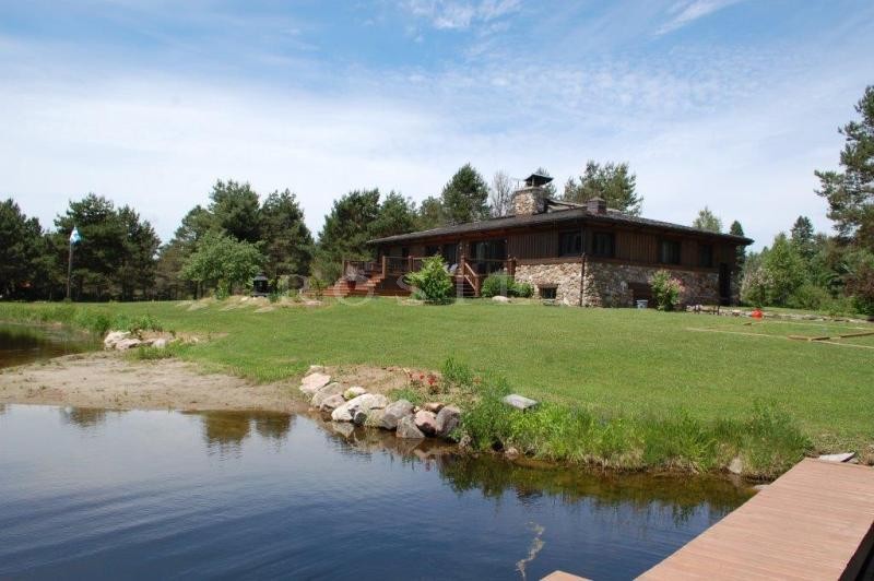 Canada, Laurentides, for sale real canadian chalet with a guest house and 2 lakes in a breathtaking scenery.