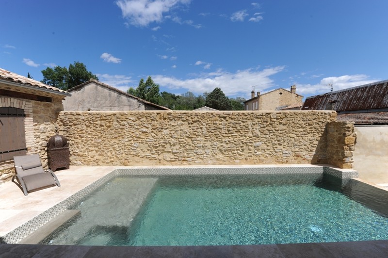 For sale, near Avignon, former factory entirely renovated, very contemporary with patio, fountain and swimming pool