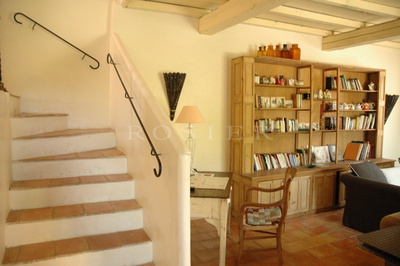 Between Gordes and Bonnieux, a few meters from the centre of the village and its shops, a village house with swimming pool for sale by Rosier.