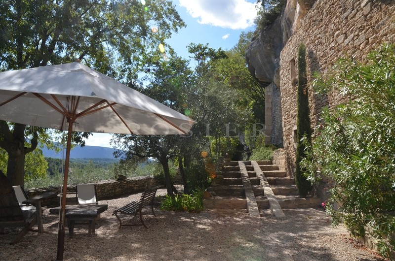 For sale, in Luberon, very original semi troglodyte house, with outbuildings, on 2 hectares with a lovely olive grove