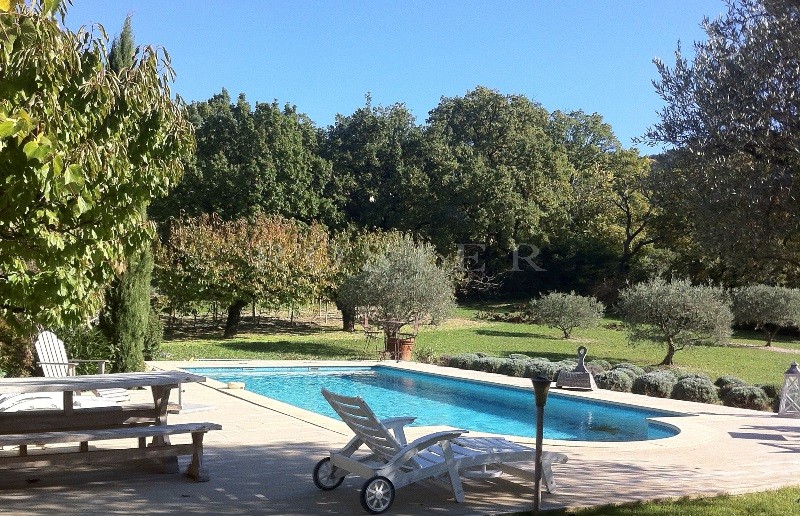 Near a beautiful village in Provence, charming traditional house with landscaped garden, swimming pool and terraces 