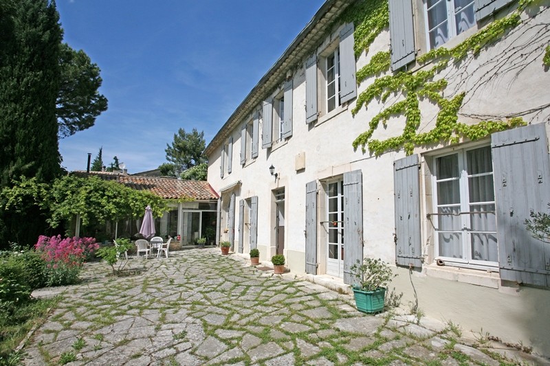For sale in Luberon, on theedge of superb hilltop village, old family mansion with garden