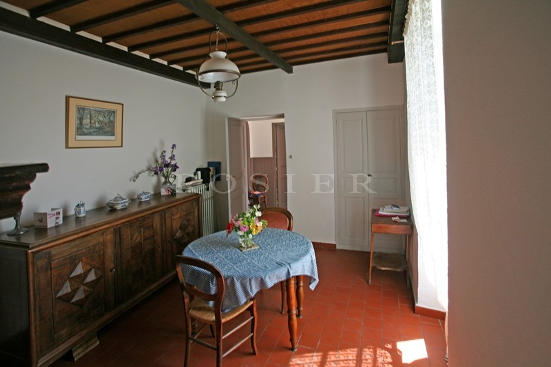 For sale in Luberon, on theedge of superb hilltop village, old family mansion with garden