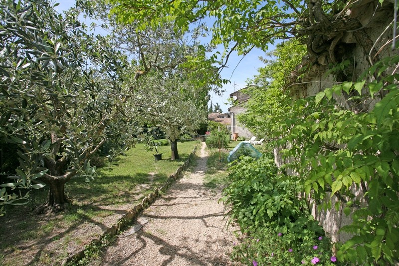 For sale in Luberon, on theedge of superb hilltop village, old family mansion with garden