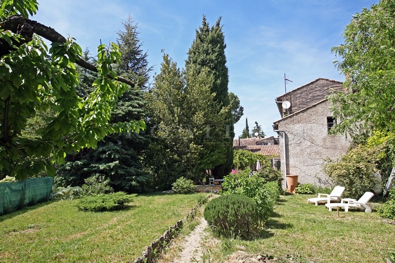 For sale in Luberon, on theedge of superb hilltop village, old family mansion with garden