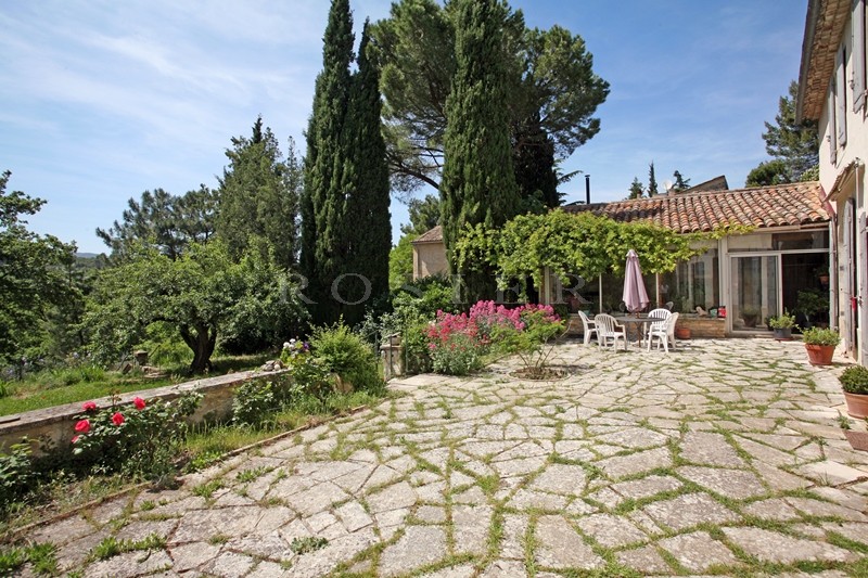 For sale in Luberon, on theedge of superb hilltop village, old family mansion with garden