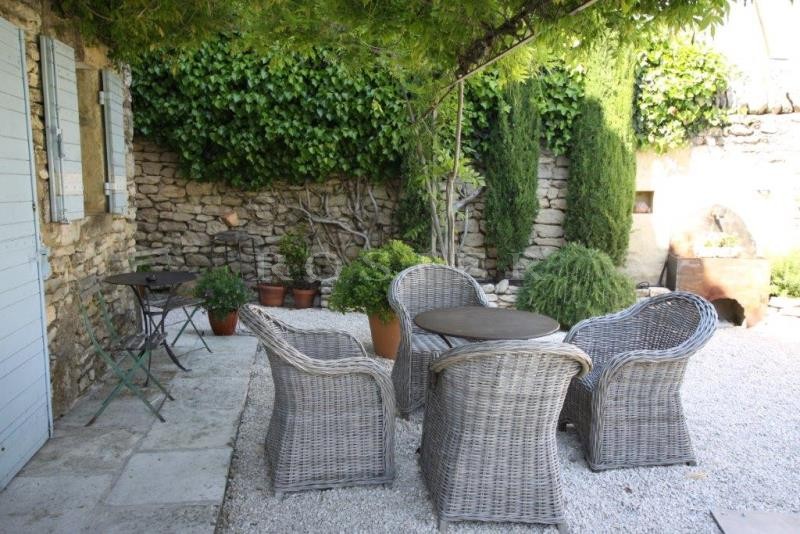 For sale, in Gordes, in a hamlet; beautiful old stone house, with terraces, garden and swimming pool