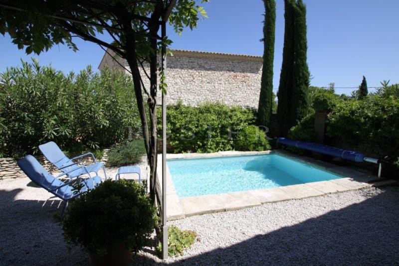 For sale, in Gordes, in a hamlet; beautiful old stone house, with terraces, garden and swimming pool