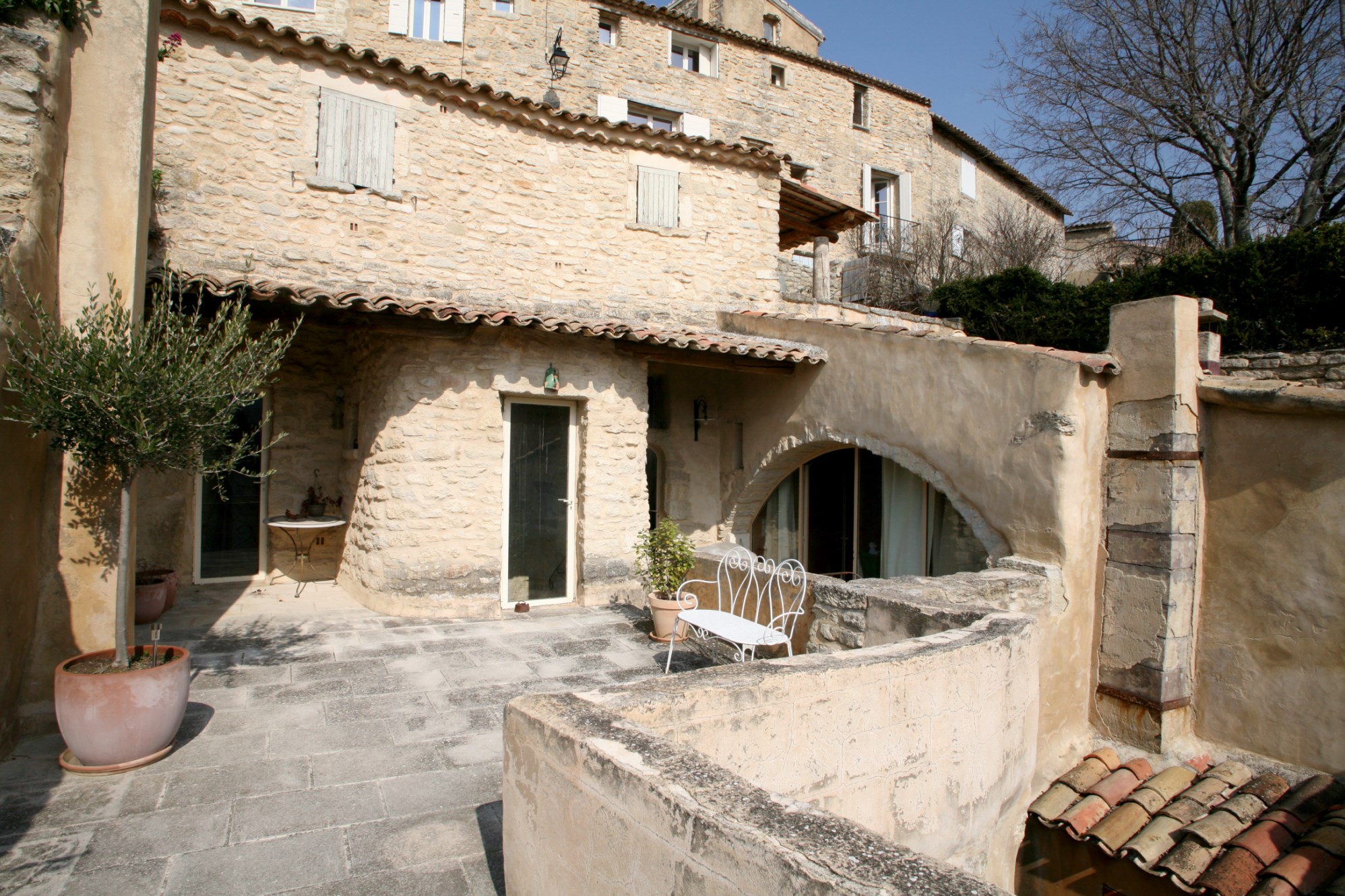 For sale in Provence, in Luberon, in a famous hilltop village, superb XVIIth century village house with patio and terrace. 